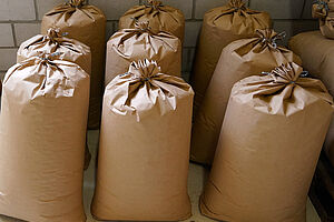 9 large, filled paper bags