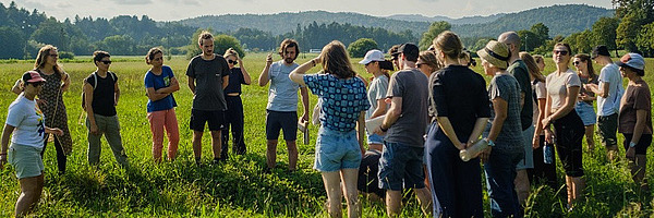 A group of people in a field.